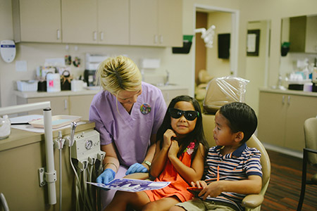 Sister and brother during dental exam